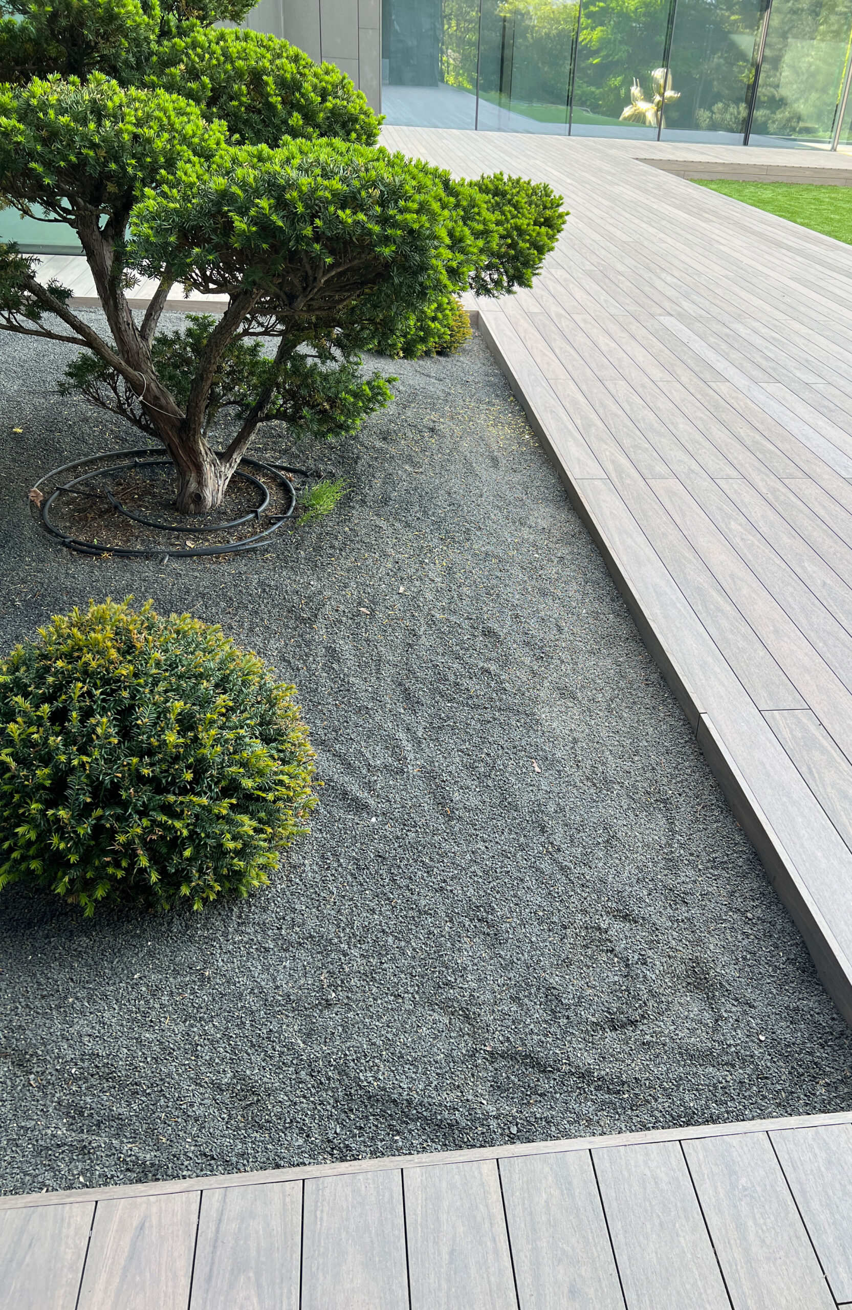 BRUGGAN Multicolor Wenge decking around a modern villa with landscaped garden in Kyiv
