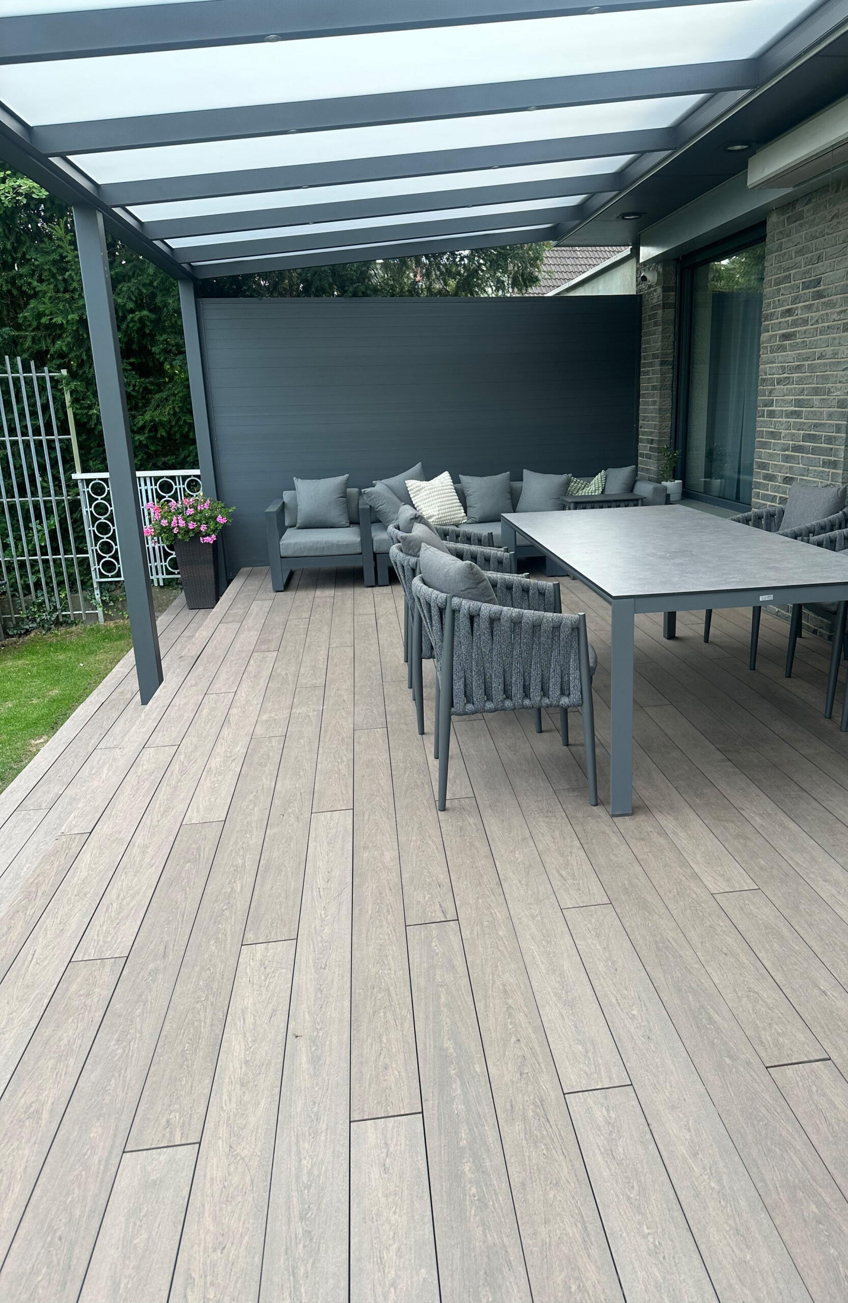 Modern garden terrace with pergola and BRUGGAN Multicolor Wenge decking boards