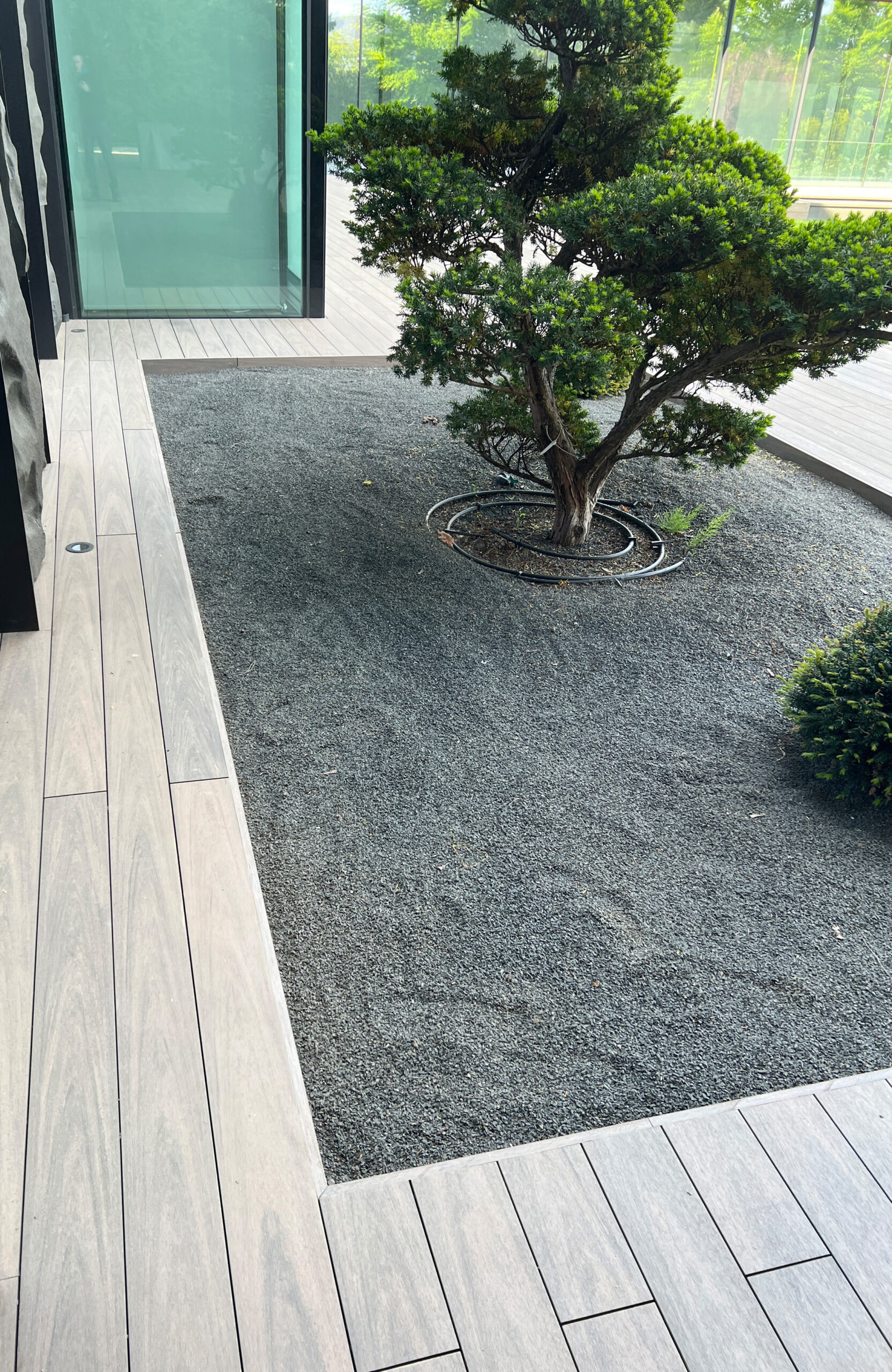 BRUGGAN Multicolor Wenge decking around a modern villa with landscaped garden in Kyiv