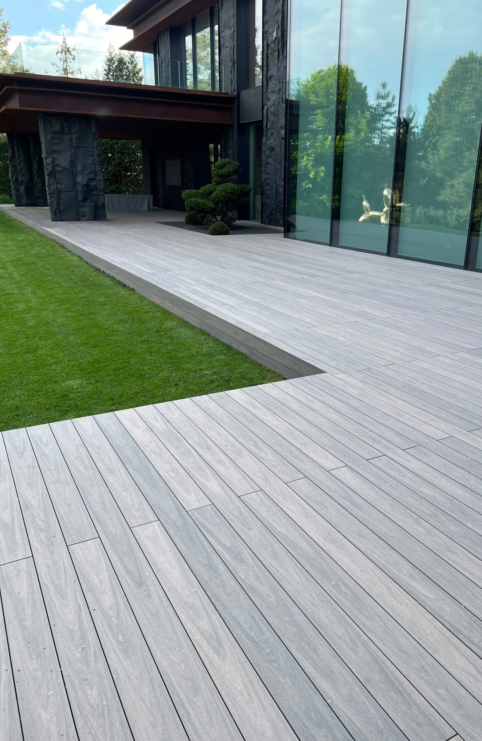 BRUGGAN Multicolor Wenge decking around a modern villa with landscaped garden in Kyiv