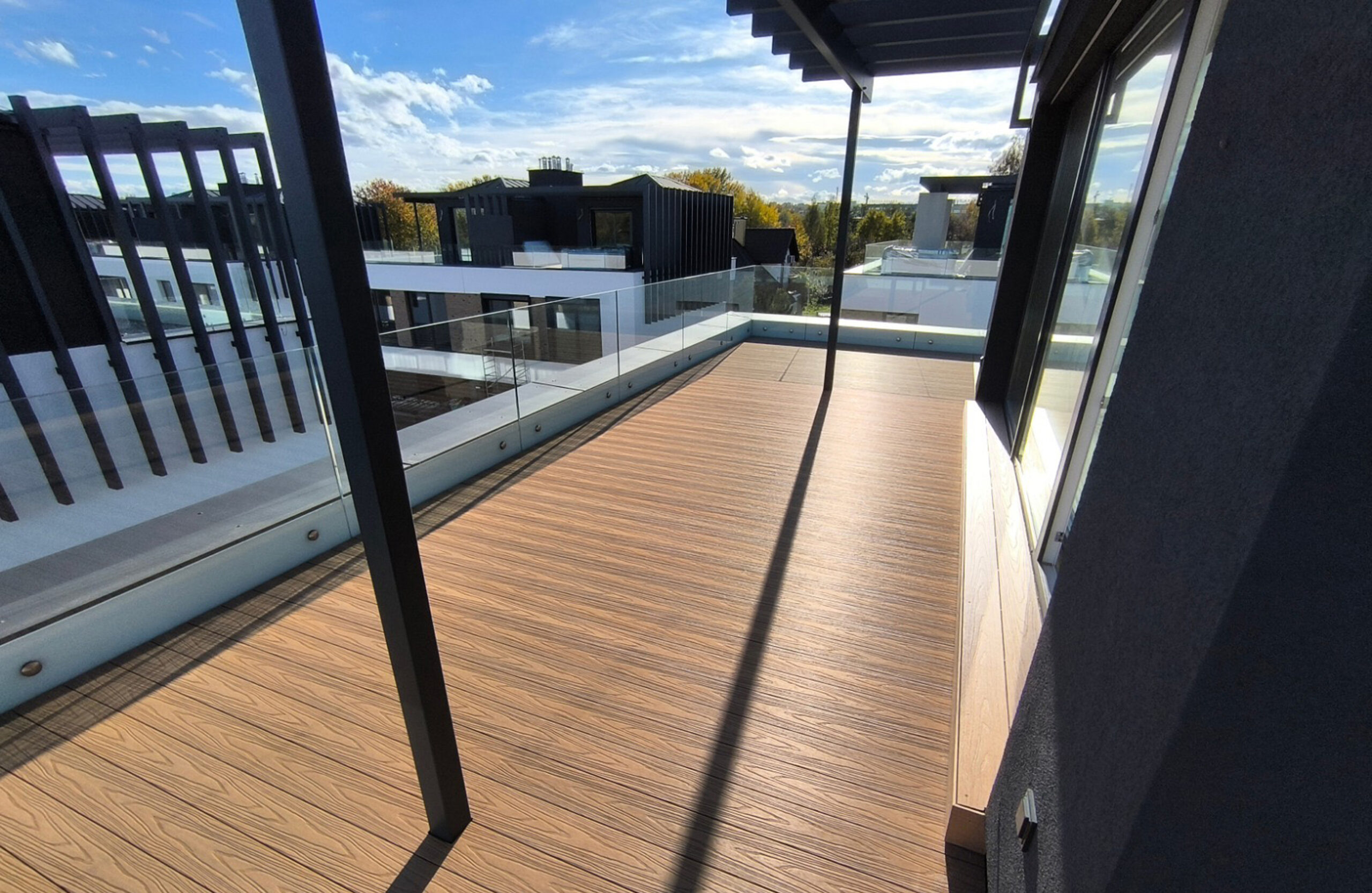 Modern rooftop terrace with Legro Maple composite decking and panoramic residential views