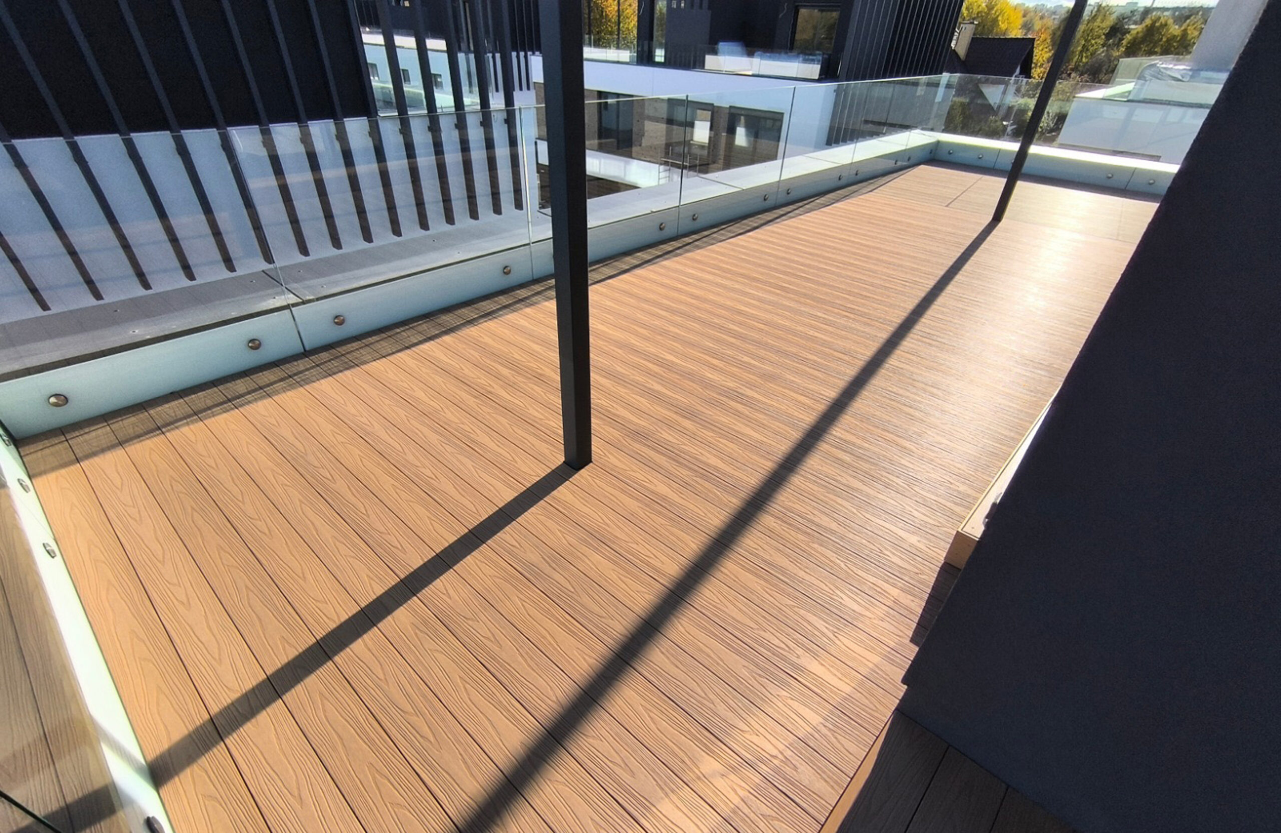 Modern rooftop terrace with Legro Maple composite decking and panoramic residential views
