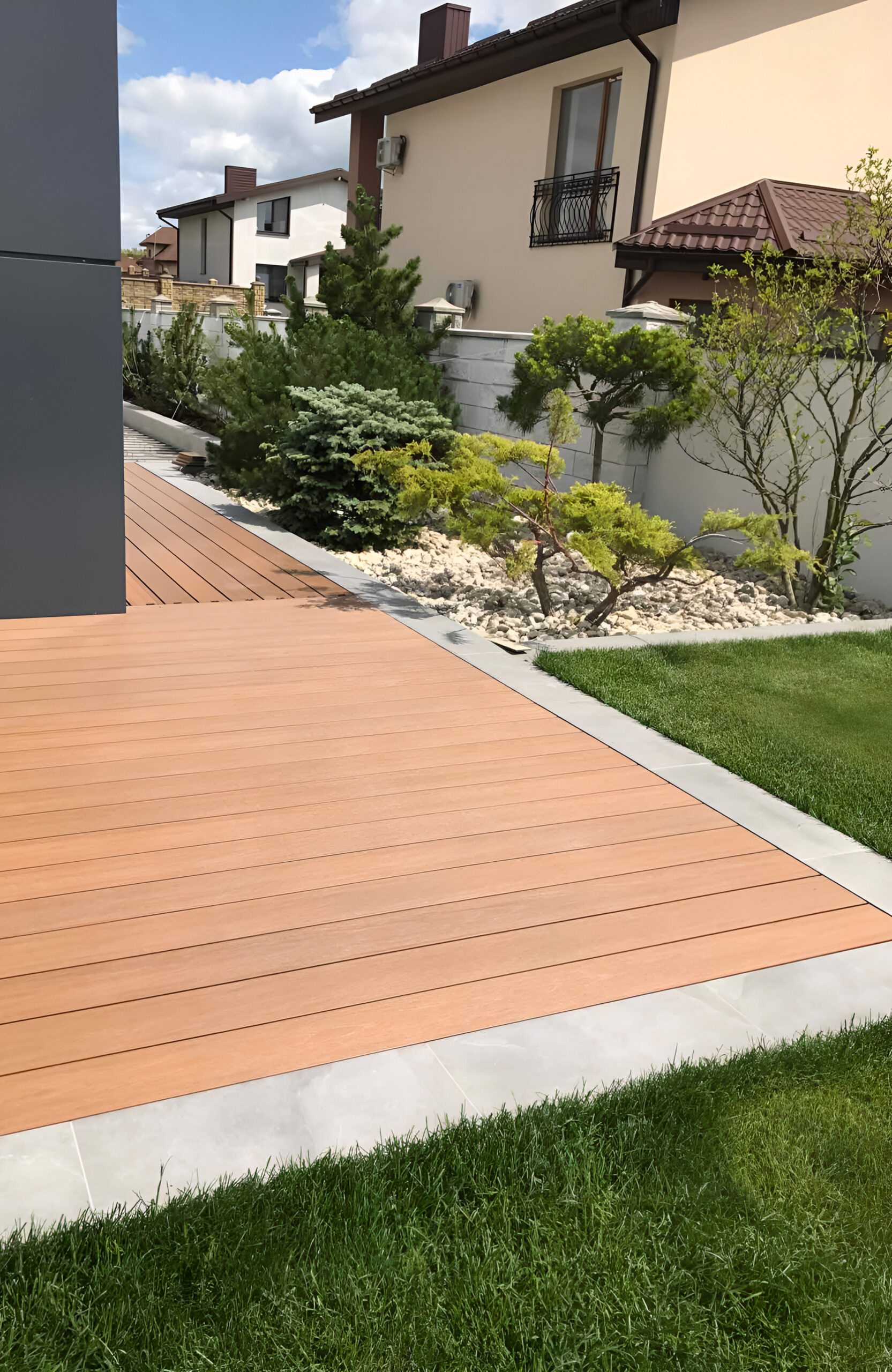 LEGRO teak WPC decking on a modern residential terrace with landscaped garden
