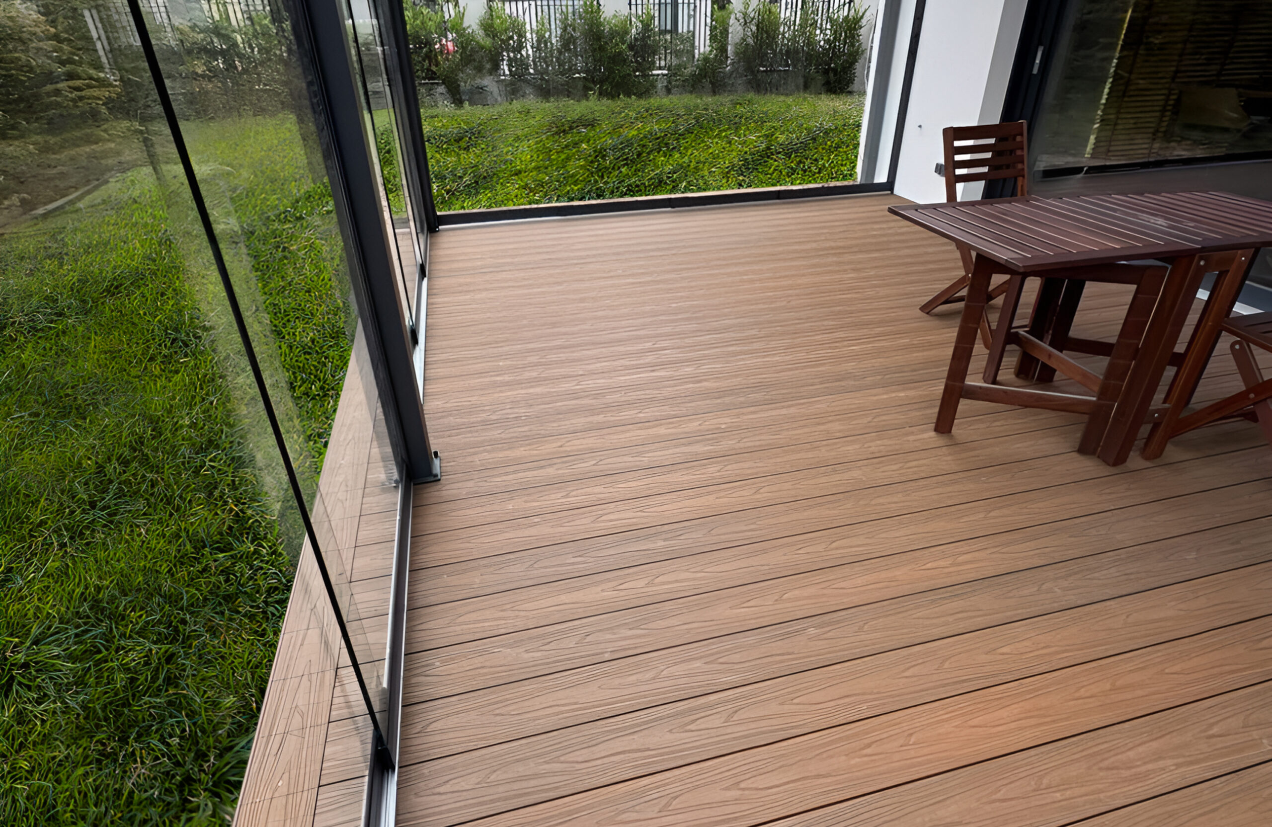 Close-up of Legro Teak wood-plastic composite decking inside a covered glass terrace