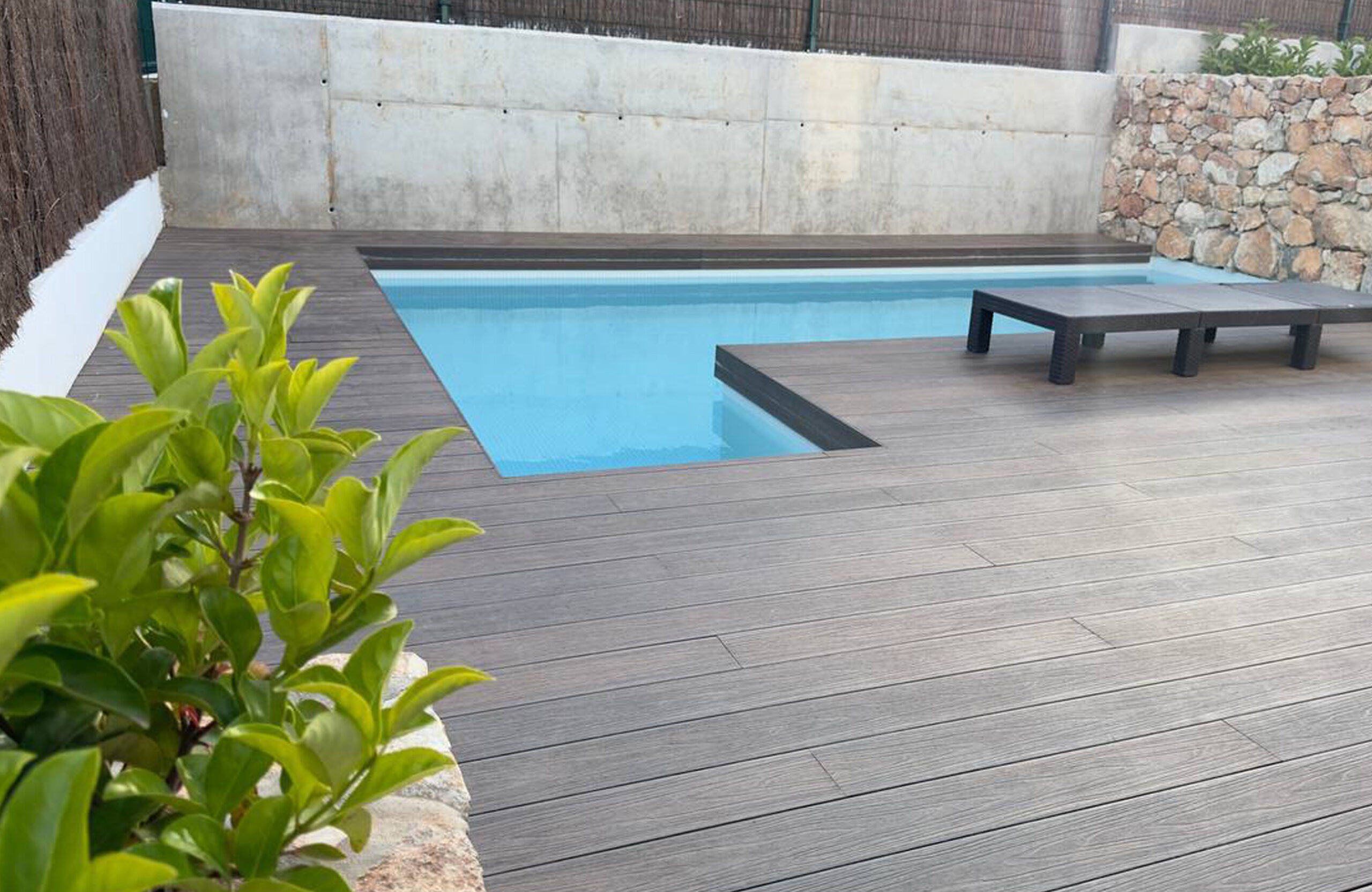Modern swimming pool terrace finished with LEGRO walnut composite decking
