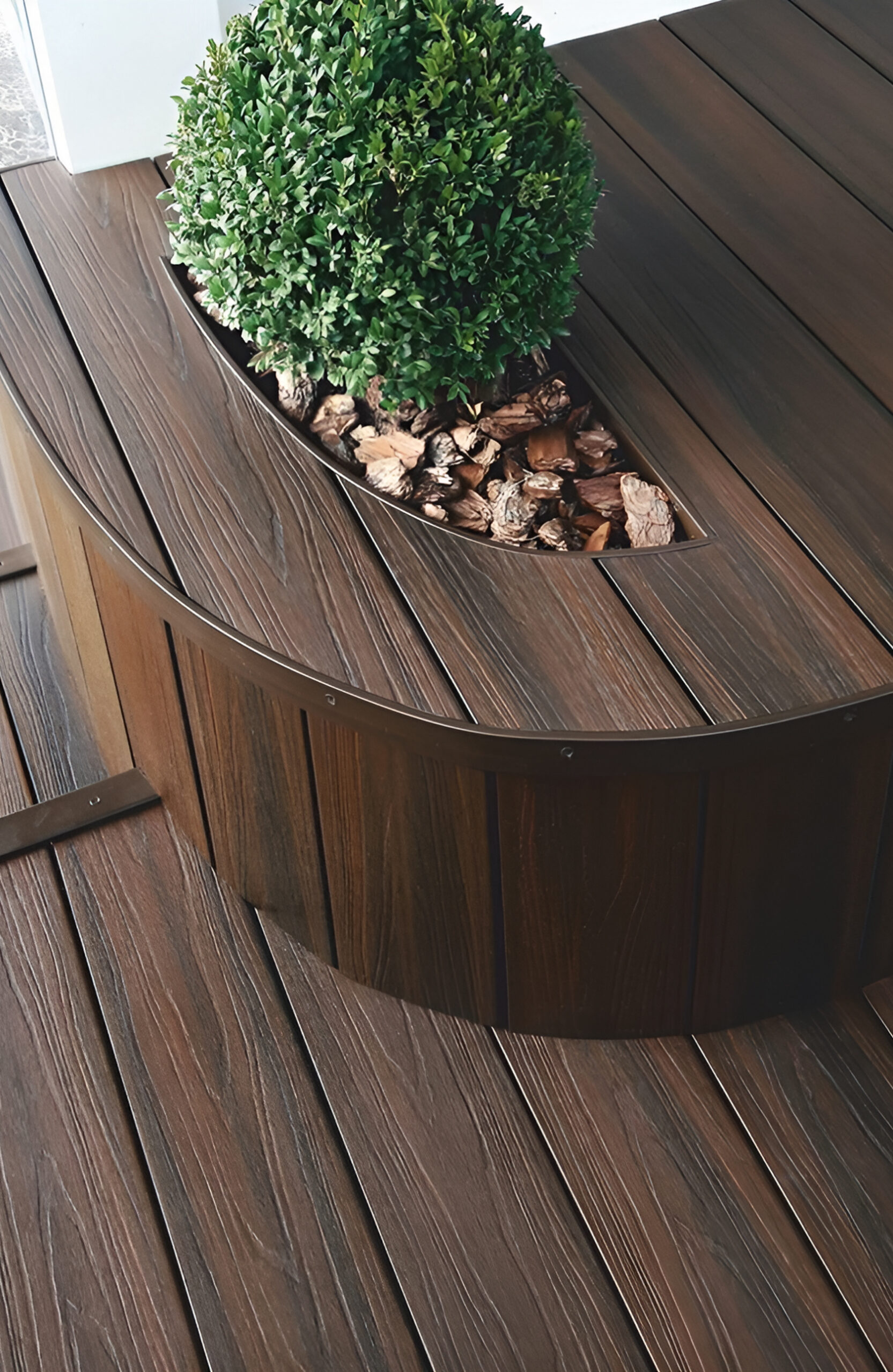 LEGRO walnut composite decking with integrated curved planter