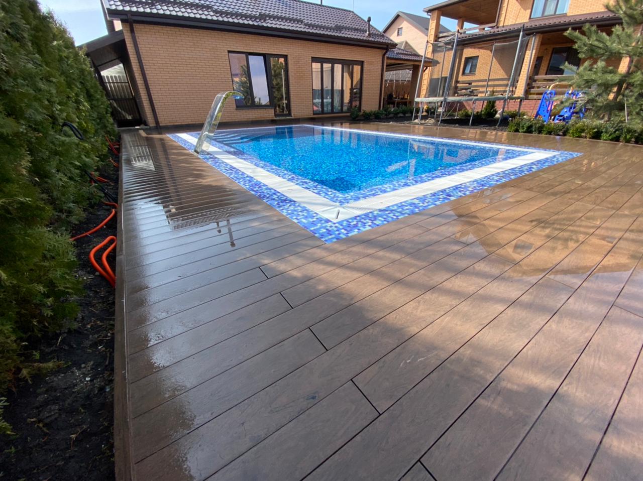Outdoor pool terrace finished with BRUGGAN Multicolor Wenge decking